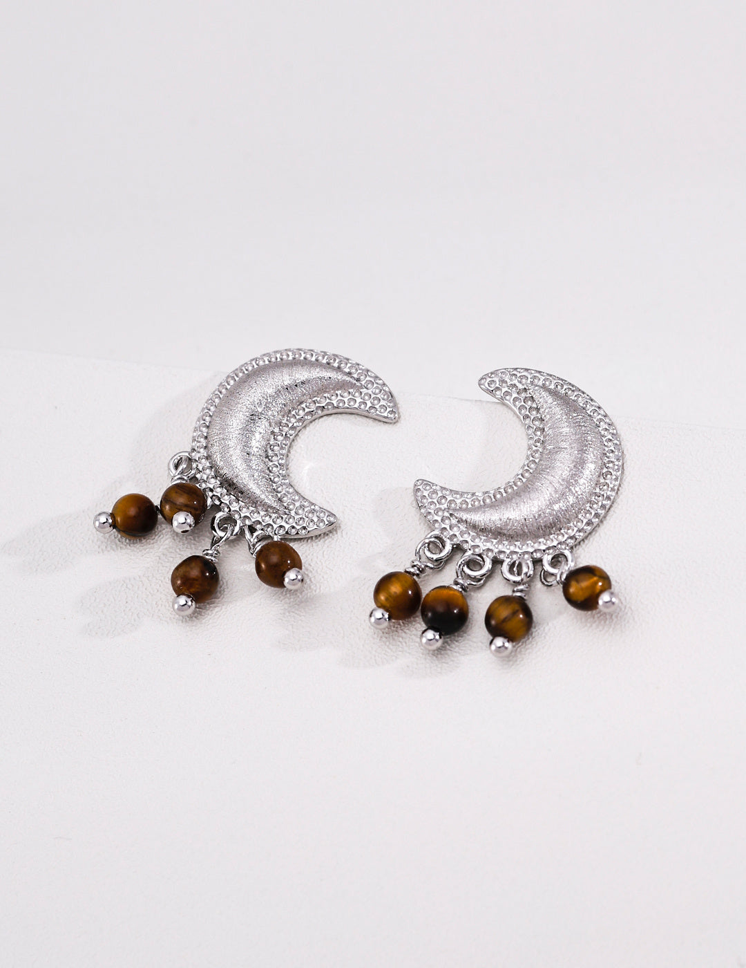 Silver grey crescent moon earrings in 925 sterling silver with tiger’s eye drops