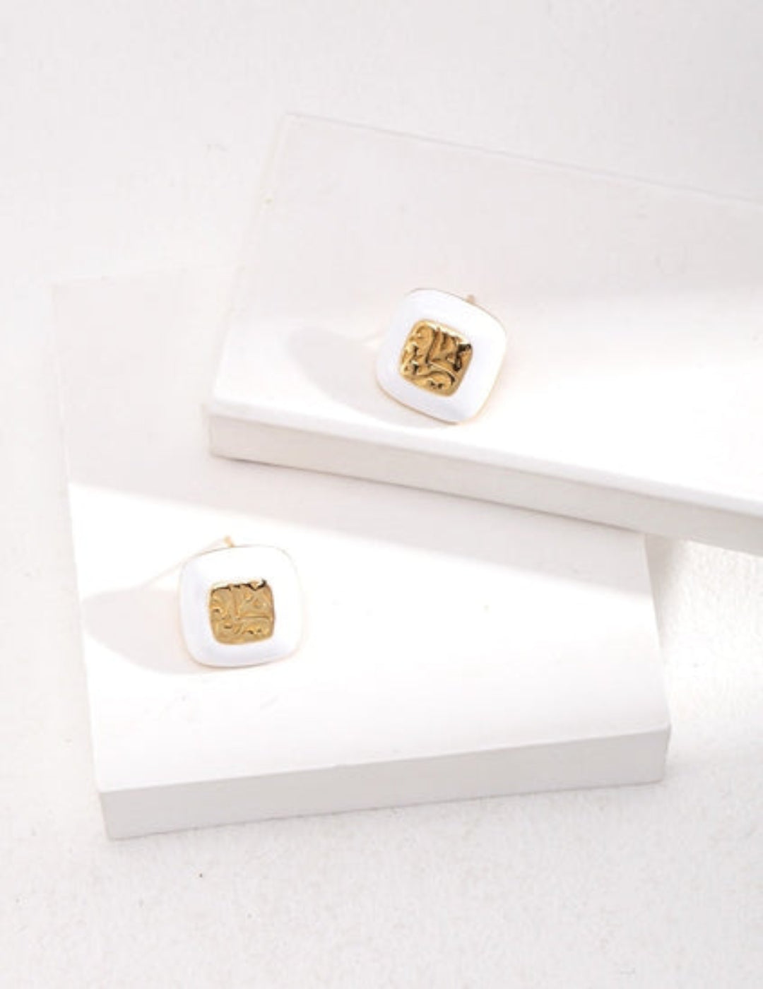 White enamel textured stud earrings