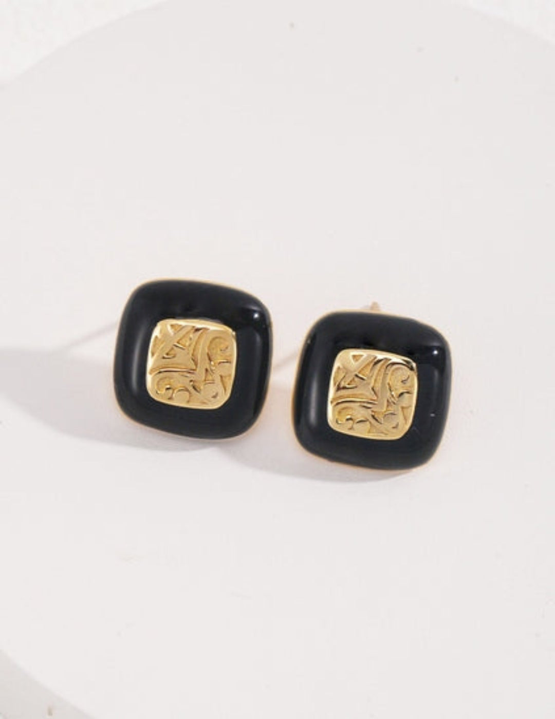 Black enamel textured stud earrings