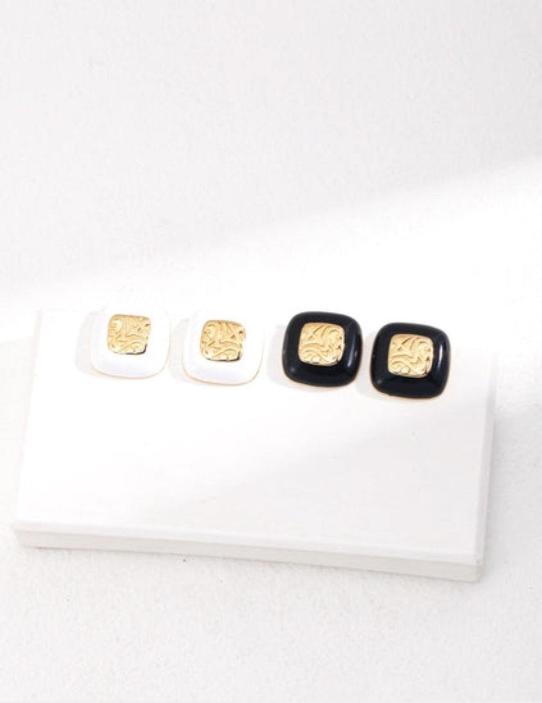 Black and white enamel earring options