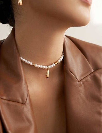 Close-up of freshwater pearl necklace on model