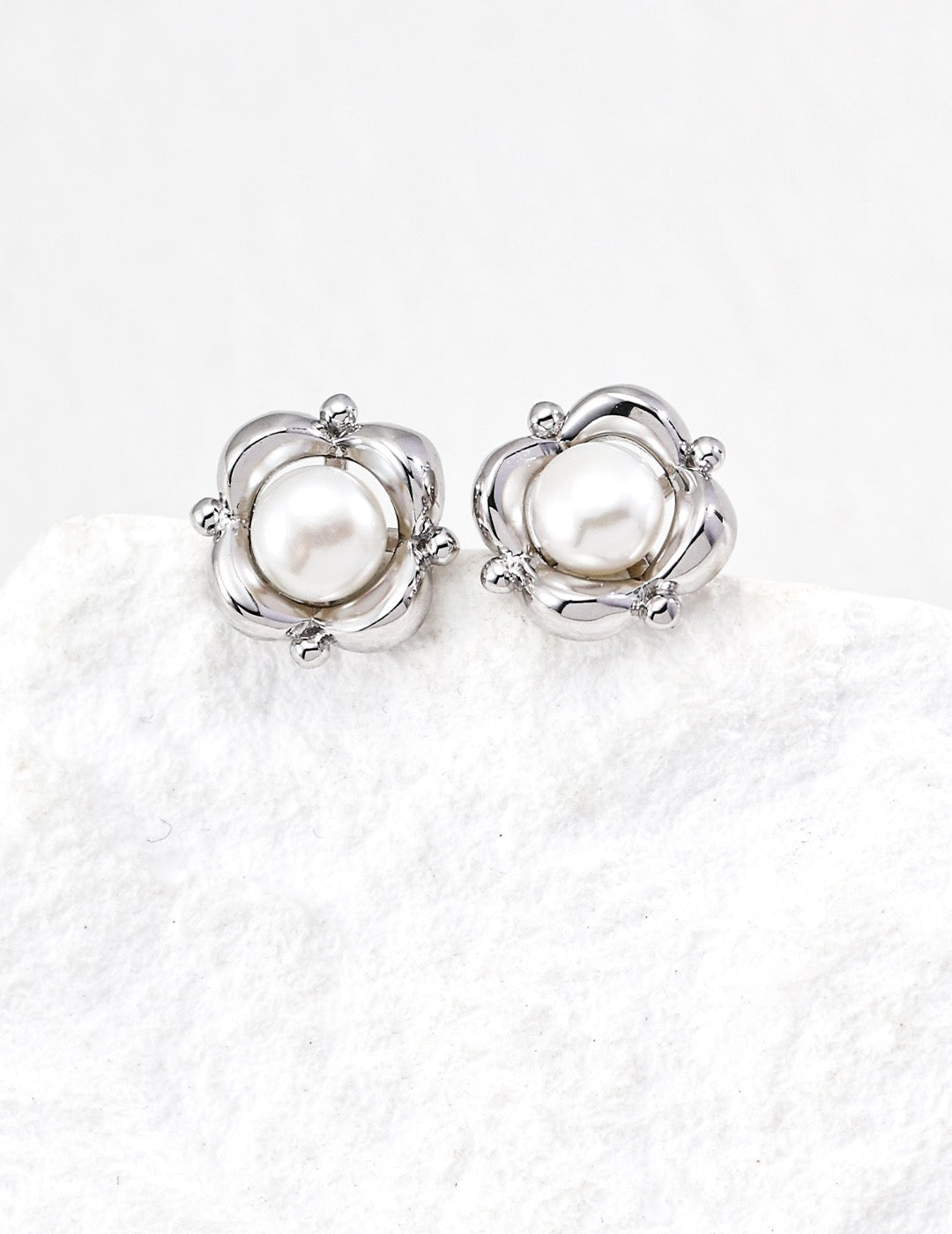 Silver pearl flower stud earrings with polished petals in 925 sterling silver