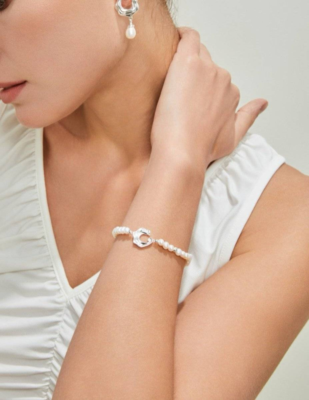 Model wearing silver freshwater pearl bracelet