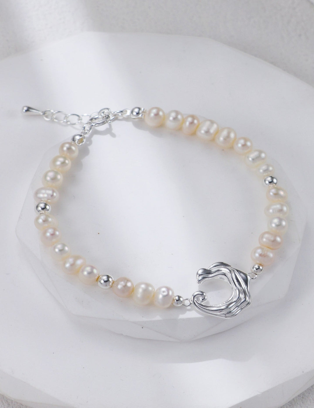 Silver wave clasp freshwater pearl bracelet