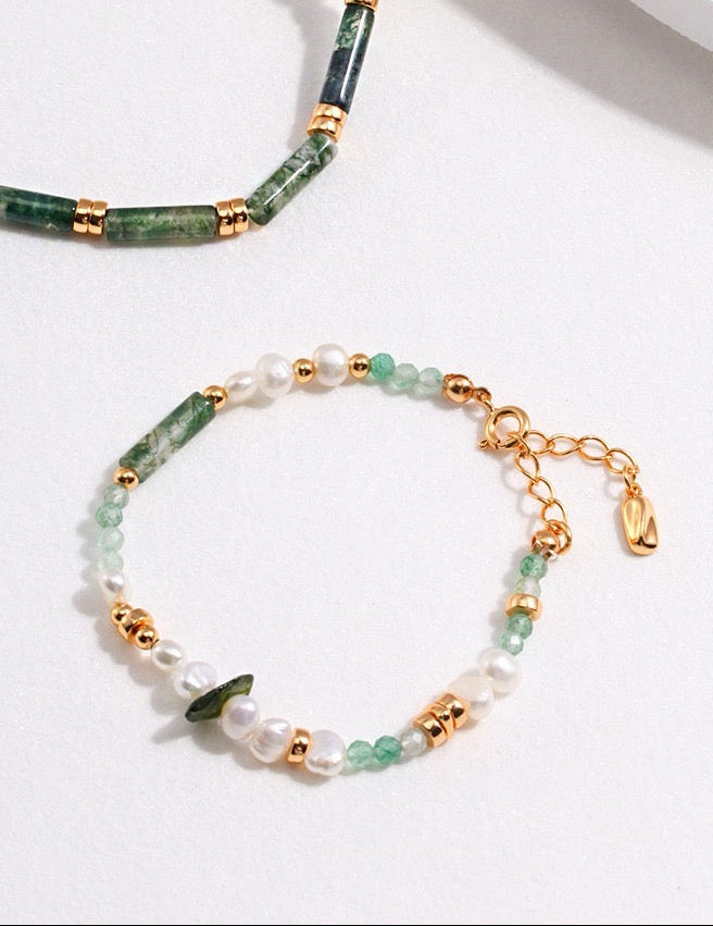 Freshwater pearl bracelet with green gemstone accents