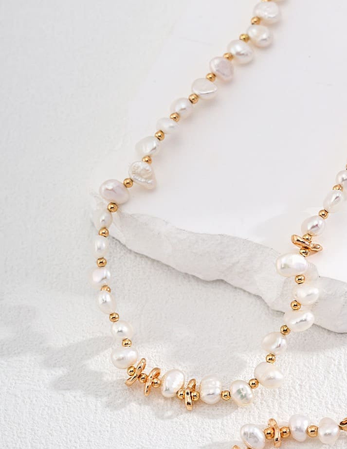 Golden Tide freshwater pearl necklace with gold-toned details